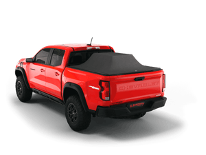 Red 2024 Chevrolet Colorado 6' 2" Bed / GMC Canyon 6' 2" Bed with loaded and expanded Sawtooth Stretch pickup truck bed cover