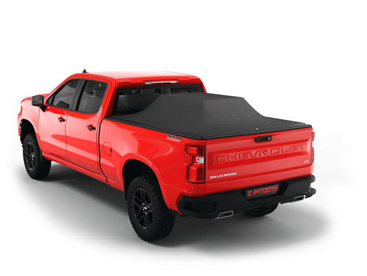 Red Chevrolet Silverado 2500HD / 3500 HD / GMC Sierra 2500HD / 3500HD  with loaded and expanded Sawtooth Stretch pickup truck bed cover