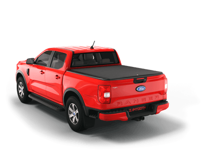 A red Ford Ranger pickup truck shown from a rear three-quarter angle on a clean white background, featuring a black Sawtooth STRETCH tonneau cover over the truck bed.