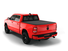 Load image into Gallery viewer, Red 2021 Ram 1500 6&#39; 4&quot; Bed with flat Sawtooth Stretch expandable tonneau cover
