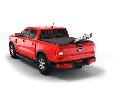 A red Ford Ranger pickup truck shown from a rear three-quarter angle on a clean white background, with a black Sawtooth STRETCH tonneau cover and a silver metal ladder placed in the bed.