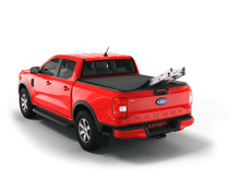 Load image into Gallery viewer, Red 2023 Ford Ranger 5&#39; Bed with ladder sticking out of Sawtooth Stretch expandable truck bed cover
