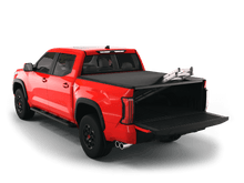 Load image into Gallery viewer, Red 2023 Toyota Tundra 5&#39; 6&quot; Bed with Sawtooth Stretch expandable tonneau cover rolled up at cab

