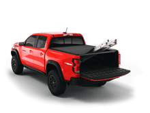 Load image into Gallery viewer, Red 2024 Chevrolet Colorado 6&#39; 2&quot; Bed / GMC Canyon 6&#39; 2&quot; Bed with Sawtooth Stretch expandable tonneau covering ladder with tailgate open
