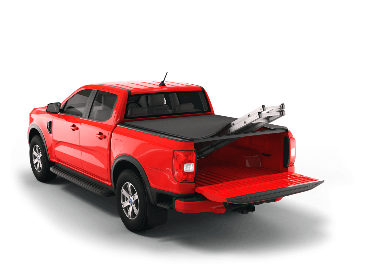 A red pickup truck shown from a rear three-quarter angle on a clean white background, with a black Sawtooth STRETCH tonneau cover over the bed and a silver ladder resting inside the open tailgate area.