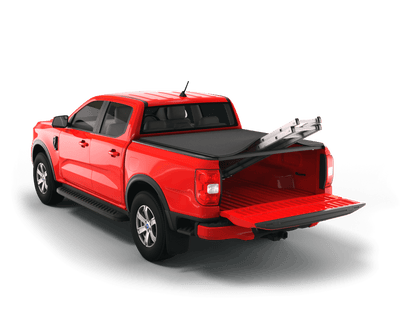 A red pickup truck shown from a rear three-quarter angle on a clean white background, with a black Sawtooth STRETCH tonneau cover over the bed and a silver ladder resting inside the open tailgate area.