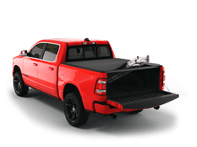 Load image into Gallery viewer, Red 2023 Ram 1500 6&#39; 4&quot; Bed with Sawtooth Stretch expandable tonneau cover rolled up at cab
