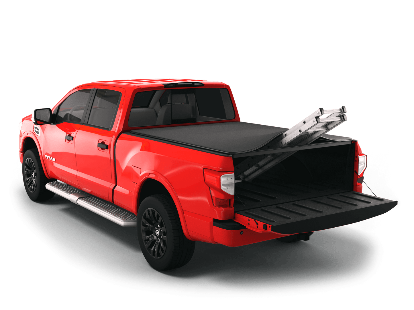 Red Nissan Titan with Sawtooth Stretch expandable tonneau cover rolled up at cab