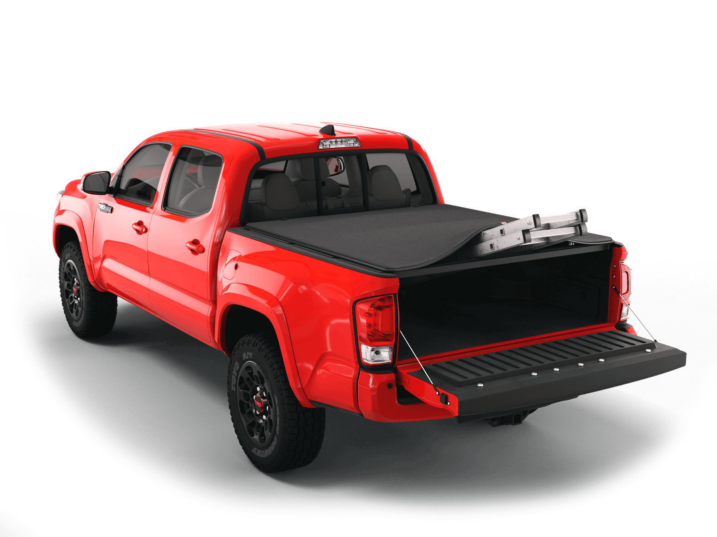 Red Toyota Tacoma with Sawtooth Stretch expandable tonneau cover rolled up at cab