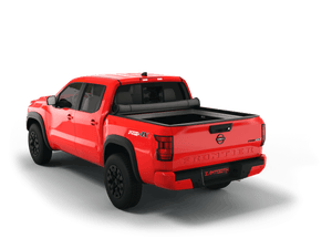 Red 2023 Nissan Frontier 6' Bed with Sawtooth Stretch expandable tonneau cover rolled up at cab