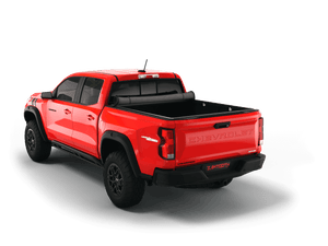 Red 2025 Chevrolet Colorado 5' 2" Bed / GMC Canyon 5' 2" Bed with Sawtooth Stretch expandable soft roll up tonneau cover rolled up. 