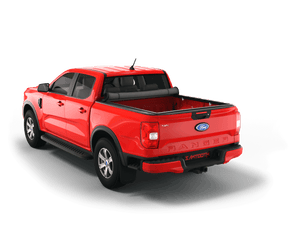Red 2023 Ford Ranger 6' Bed with gear in the truck bed and the Sawtooth Stretch tonneau cover rolled up at cab 