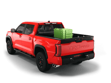 Load image into Gallery viewer, Red 2022 Toyota Tundra 5&#39; 6&quot; Bed with gear in the truck bed and the Sawtooth Stretch tonneau cover rolled up at cab 
