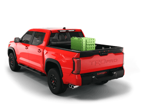 Red 2022 Toyota Tundra 6' 6" Bed with gear in the truck bed and the Sawtooth Stretch tonneau cover rolled up at cab 