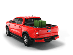 Red 2024 Ford Ranger 5' Bed with gear in the truck bed and the Sawtooth Stretch tonneau cover expanded over cargo load