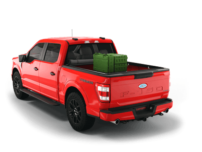Red Ford F-250 / Ford F-350 with gear in the truck bed and the Sawtooth Stretch tonneau cover rolled up at cab 