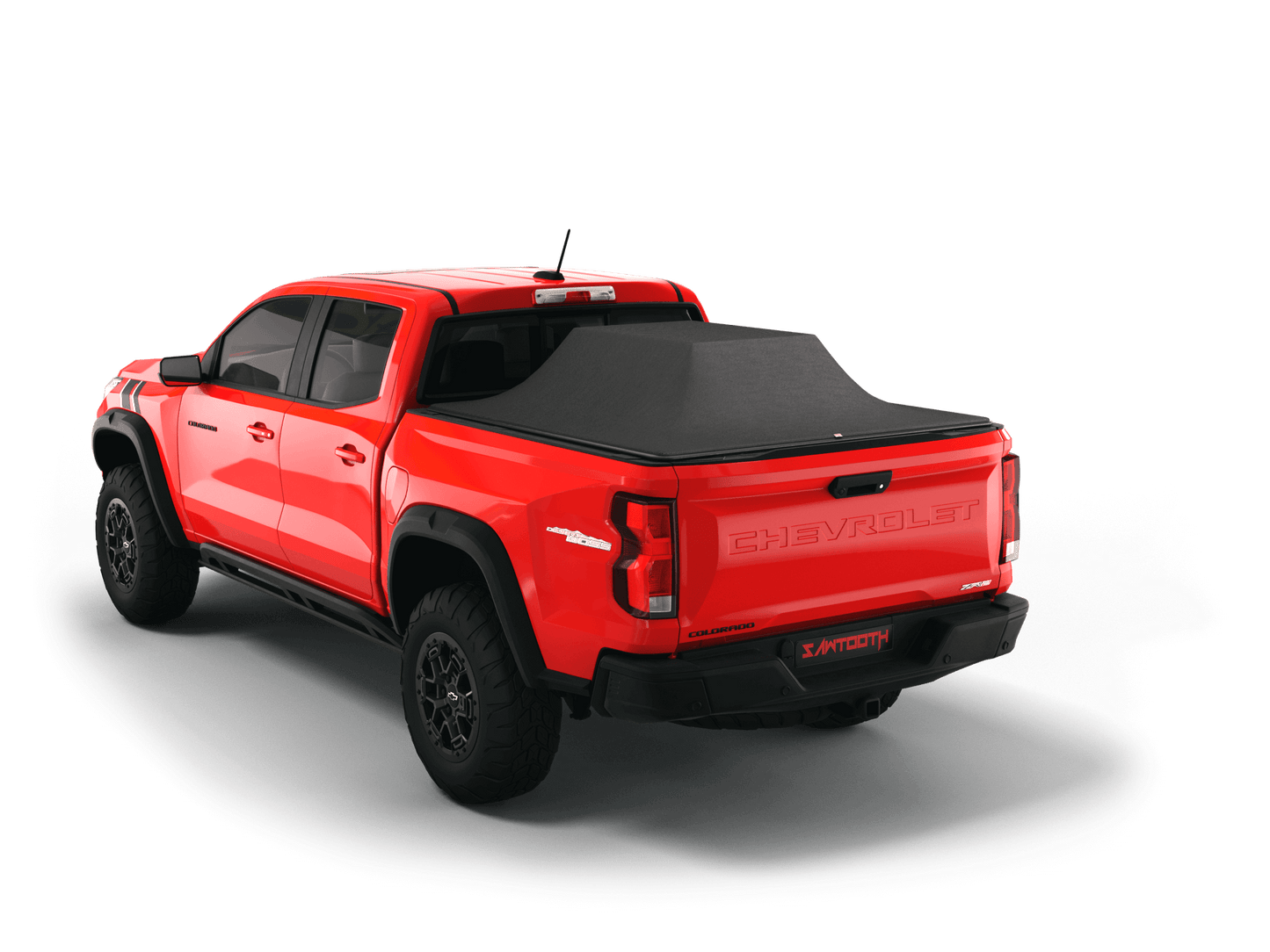 Red Chevrolet Colorado / GMC Canyon with gear in the truck bed and the Sawtooth Stretch tonneau cover expanded over cargo load
