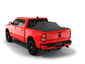 Red 2020 Ram 1500 6' 4" Bed with gear in the truck bed and the Sawtooth Stretch tonneau cover expanded over cargo load