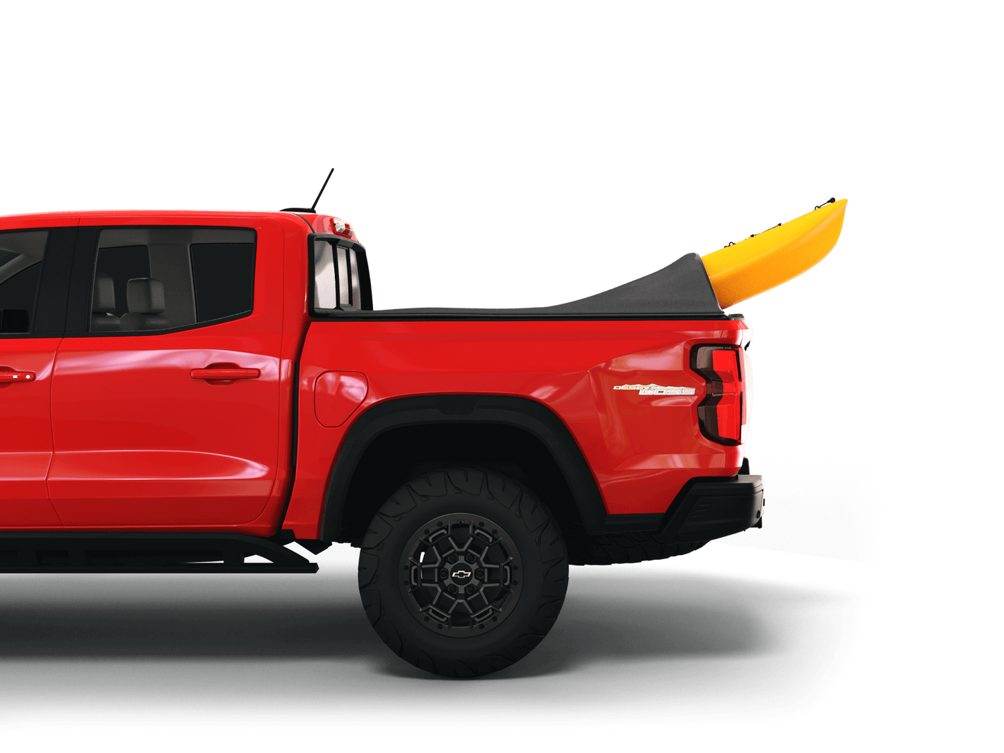 Red Chevrolet Colorado / GMC Canyon with yellow kayak under sawtooth stretch truck bed cover