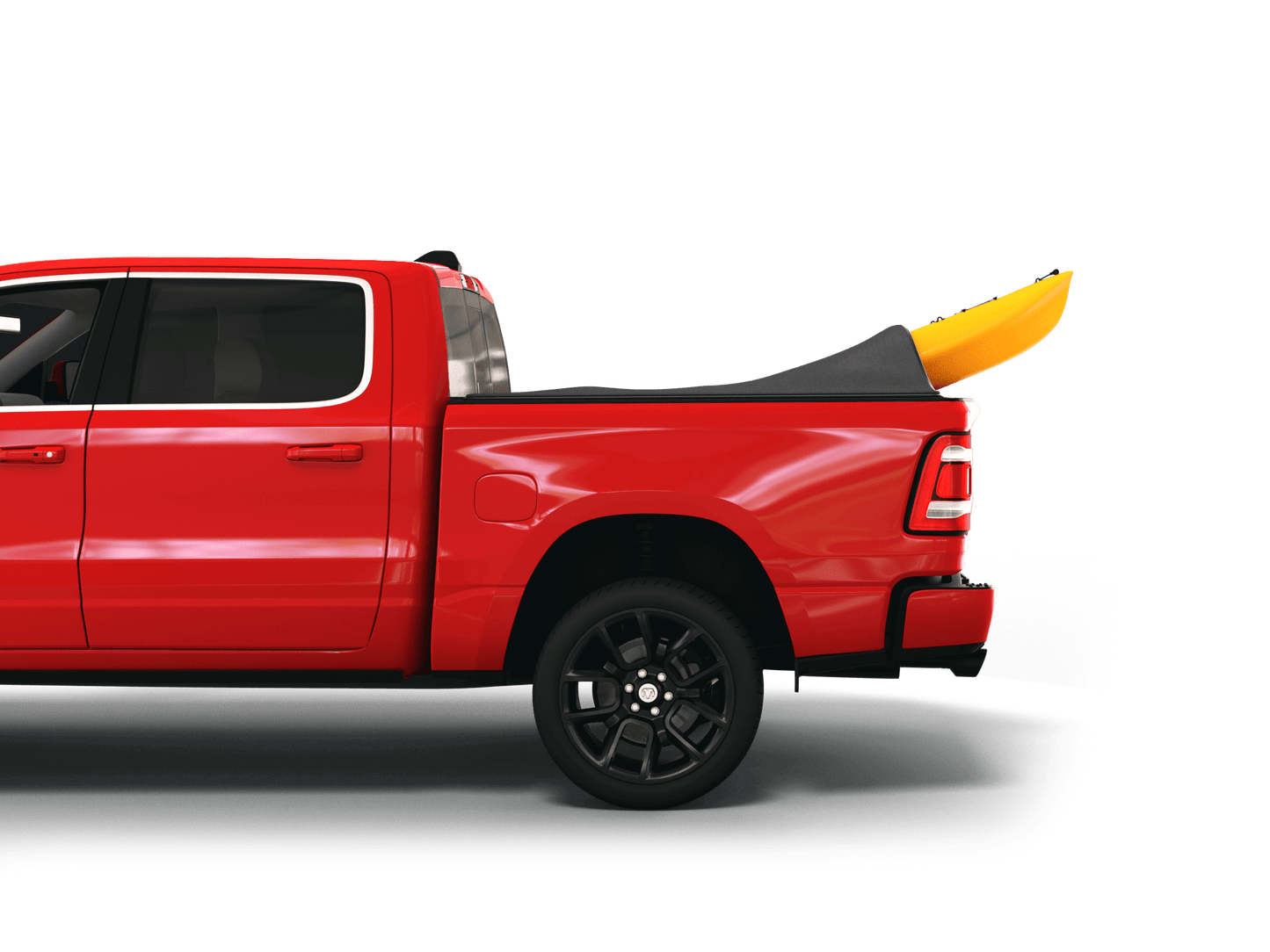 Red Ram 1500 with yellow kayak under sawtooth stretch truck bed cover