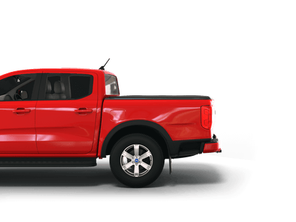 A red Ford pickup truck shown from the rear three-quarter side view, featuring a flat black Sawtooth STRETCH truck bed cover and silver multi-spoke alloy wheels, isolated on a white background.