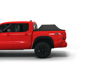 Red 2023 Nissan Frontier 6' Bed with Sawtooth Stretch tonneau cover expanded over cargo load