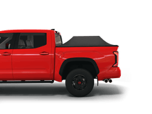 Load image into Gallery viewer, Red 2023 Toyota Tundra 5&#39; 6&quot; Bed with Sawtooth Stretch tonneau cover expanded over cargo load
