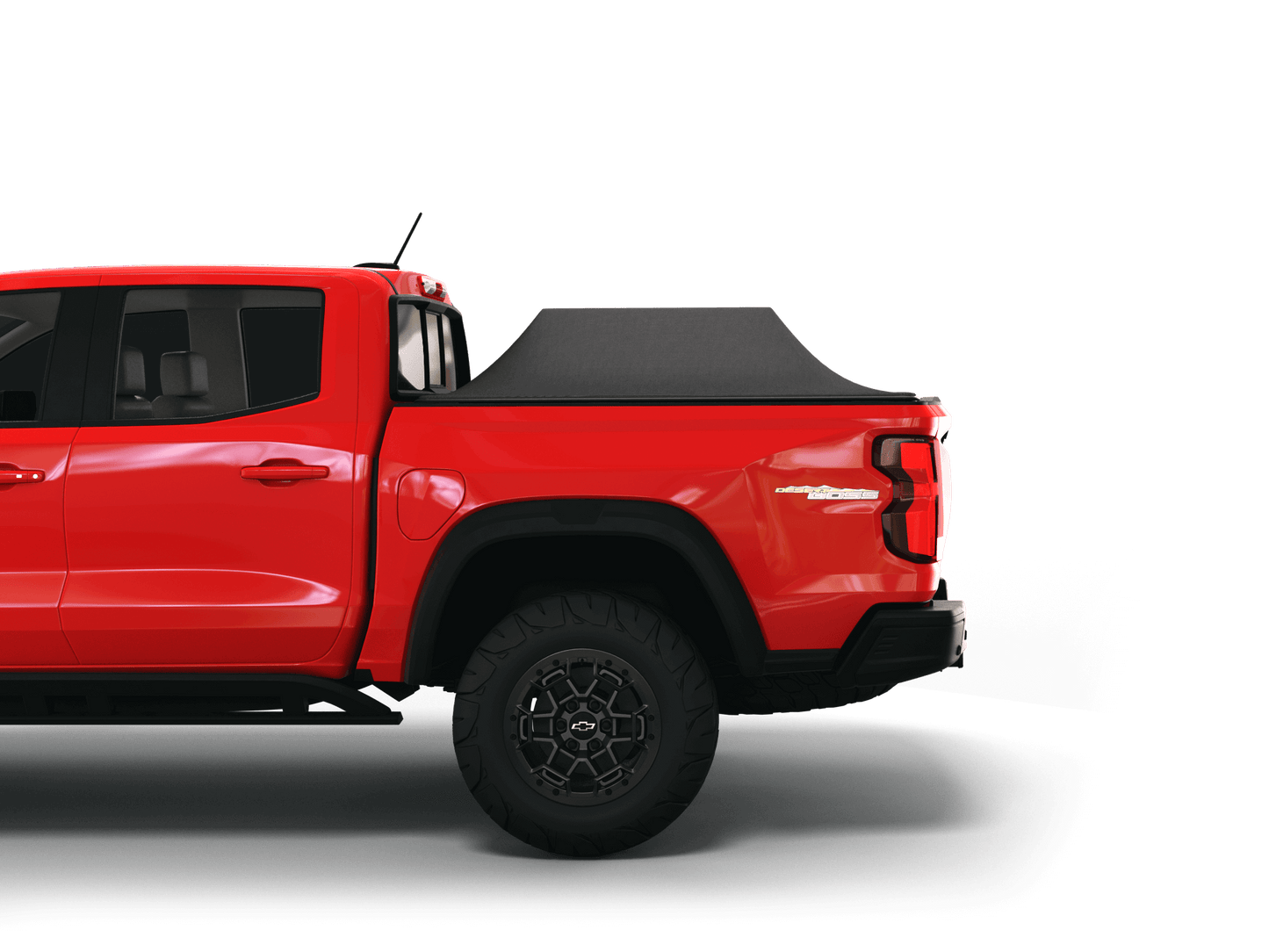 Red Chevrolet Colorado / GMC Canyon with Sawtooth Stretch tonneau cover expanded over cargo load