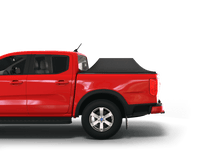 Load image into Gallery viewer, Red 2024 Ford Ranger 5&#39; Bed with Sawtooth Stretch tonneau cover expanded over cargo load
