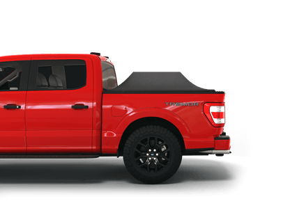 Red Ford F-250 / Ford F-350 with Sawtooth Stretch tonneau cover expanded over cargo load