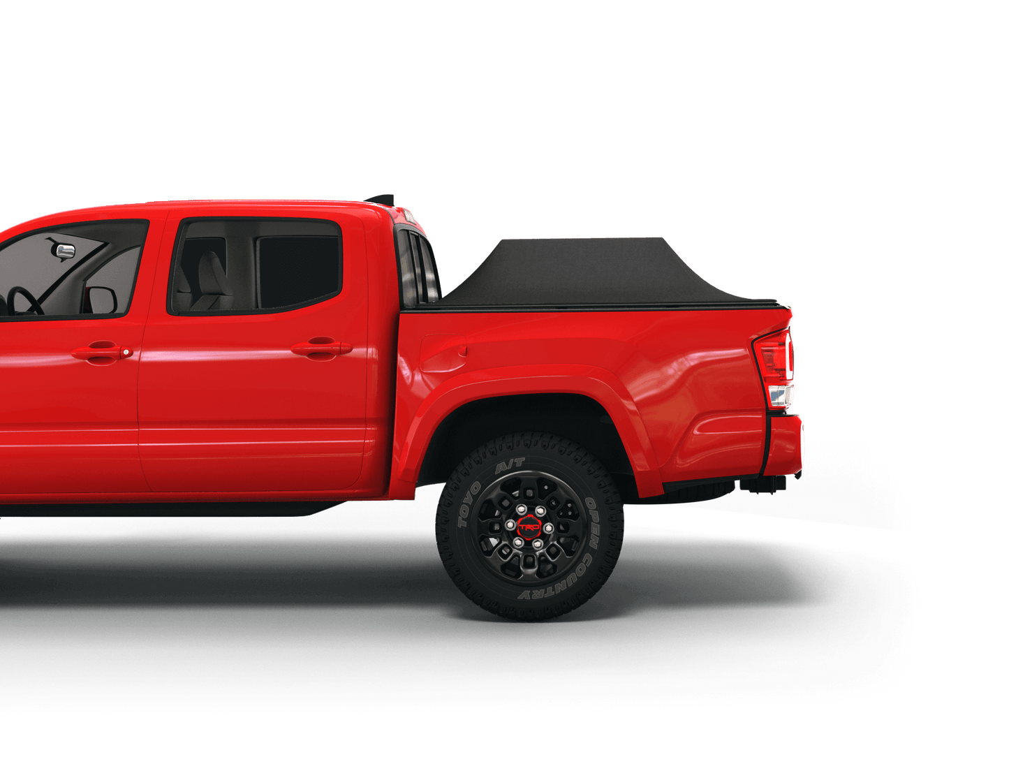 Red Toyota Tacoma with Sawtooth Stretch tonneau cover expanded over cargo load