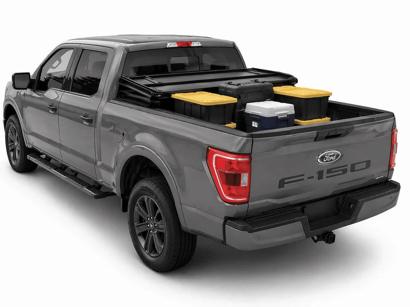 Conventional folding cover opened on a Ford F-150, leaving cargo exposed