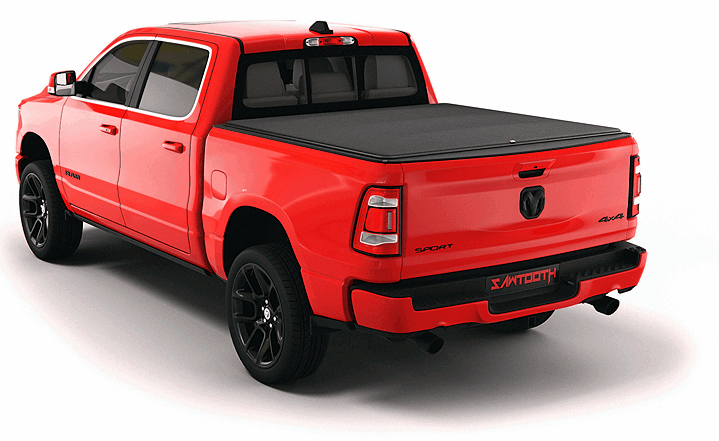 Red Ram 1500 pickup truck with tonneau cover viewed from rear