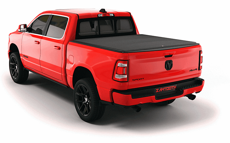 Red Ram 1500 pickup truck with black tonneau cover viewed from rear three-quarter angle