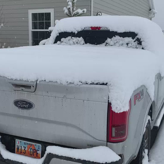Silver Ford F-150 with snow covered Sawtooth Stretch tonneau