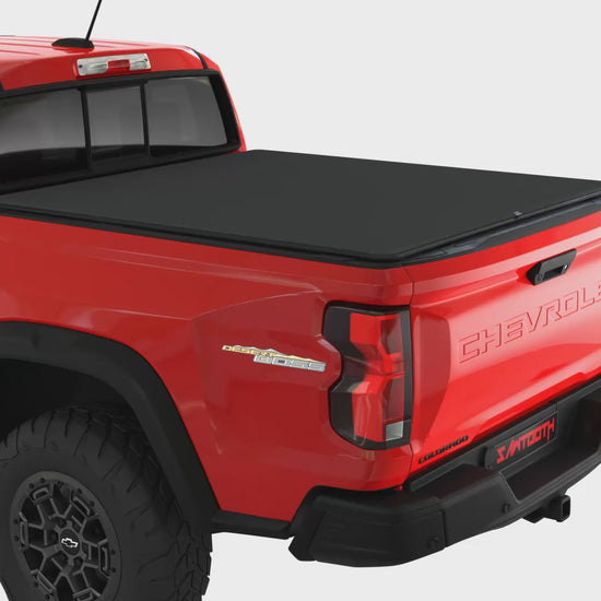Sawtooth STRETCH video showing how the expandable tonneau works on a red pickup truck with a white background.