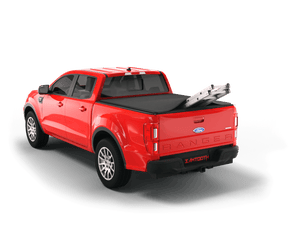 Red 2022 Ford Ranger with ladder sticking out of Sawtooth Stretch expandable truck bed cover