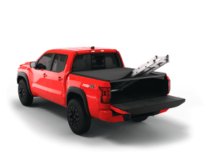 Red 2022 Nissan Frontier 5' Bed with ladder sticking out of Sawtooth Stretch expandable truck bed cover with the tailgate open
