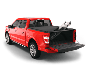 Red 2019 Ford F-150 5' 7" Bed with Sawtooth Stretch expandable tonneau cover rolled up at cab