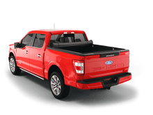 Load image into Gallery viewer, Red 2014 Ford F-150 5&#39; 7&quot; Bed with Sawtooth Stretch expandable soft roll up tonneau cover with ladder and open tailgate 
