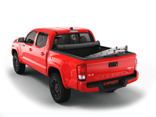 Load image into Gallery viewer, Red 2020 Toyota Tacoma 5&#39; Bed with Sawtooth Stretch expandable soft roll up tonneau cover with ladder and open tailgate 
