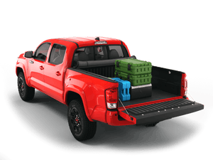 Red 2021 Toyota Tacoma 5' Bed with gear in the truck bed and the Sawtooth Stretch tonneau cover rolled up at cab 