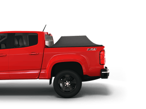Red 2017 Chevrolet Colorado 5' 2" Bed / GMC Canyon 5' 2" Bed with Sawtooth Stretch tonneau cover expanded over cargo load
