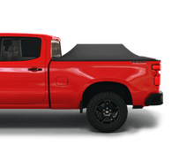 Load image into Gallery viewer, Red 2020 Chevrolet Silverado 2500 3500 6&#39;-9&quot; bed / GMC Sierra 2500 3500 6&#39;-9&quot; bed with Sawtooth Stretch tonneau cover expanded over cargo load
