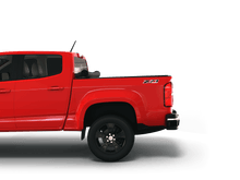 Load image into Gallery viewer, Red 2018 Chevrolet Colorado 5&#39; 2&quot; Bed / GMC Canyon 5&#39; 2&quot; Bed with Sawtooth Stretch expandable pickup truck bed cover rolled up at cab
