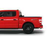 Load image into Gallery viewer, Red 2024 Ford F-150 5&#39; 7&quot; Bed with Sawtooth Stretch expandable pickup truck bed cover rolled up at cab
