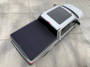 looking down on a Silver Ford F-150 5' 7" Bed with Sawtooth Stretch pickup truck bed cover