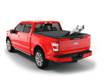 Load image into Gallery viewer, red 2004 2005 2006 2007 2008 Ford F-150 5&#39; 7&quot; bed with ladder sticking out of sawtooth stretch expandable truck bed cover expandable tonneau cover
